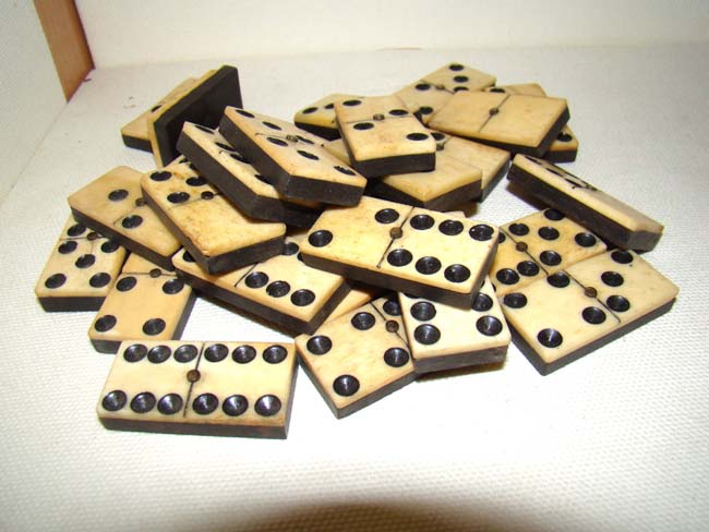 A complete set (28 pieces) of Civil War era circa 1865 bone and ebony dominoes